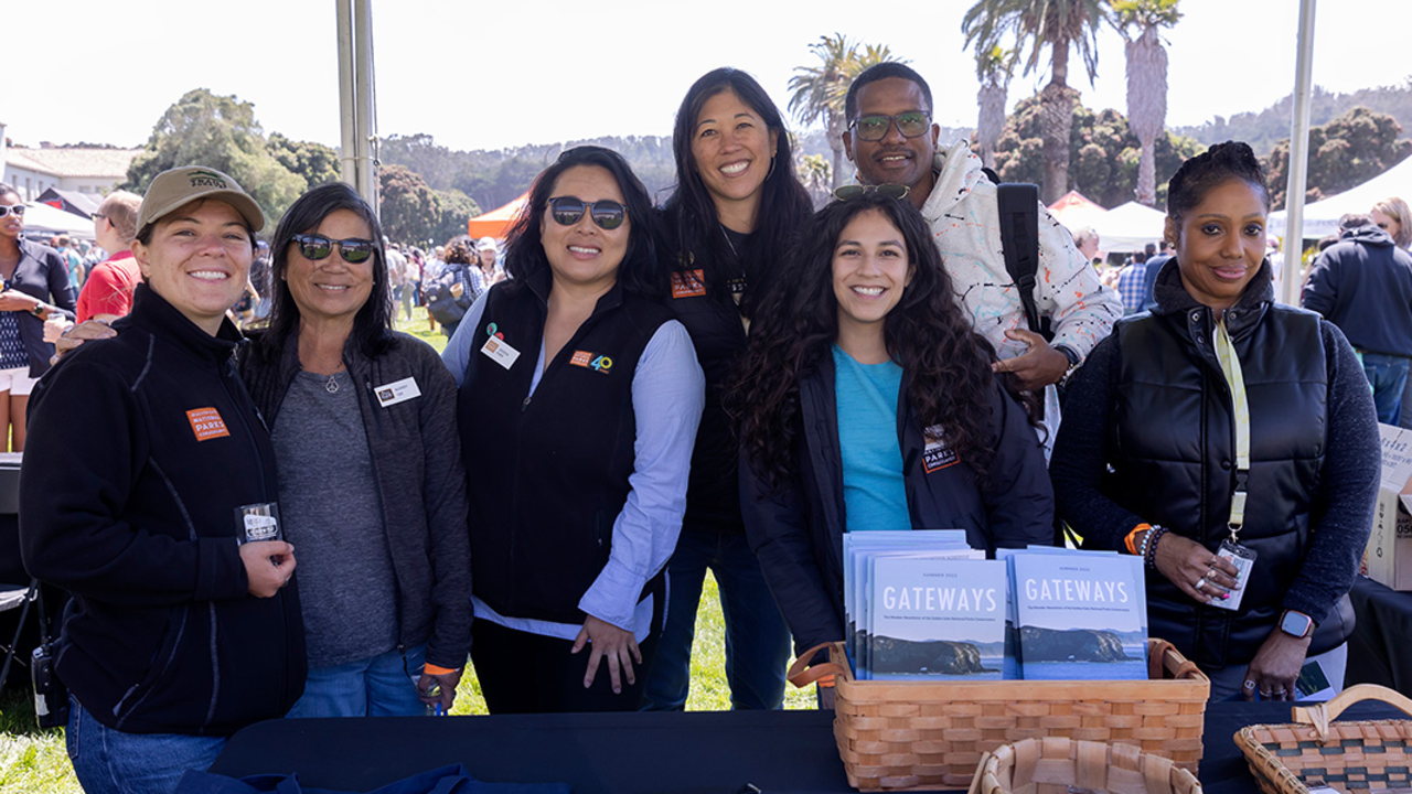 A group of Parks Conservancy staff pose for a photo at Parks4All: Brewfest, a beer festival and fundraiser, on Saturday, July 29th, 2023 in the Presidio of San Francisco.