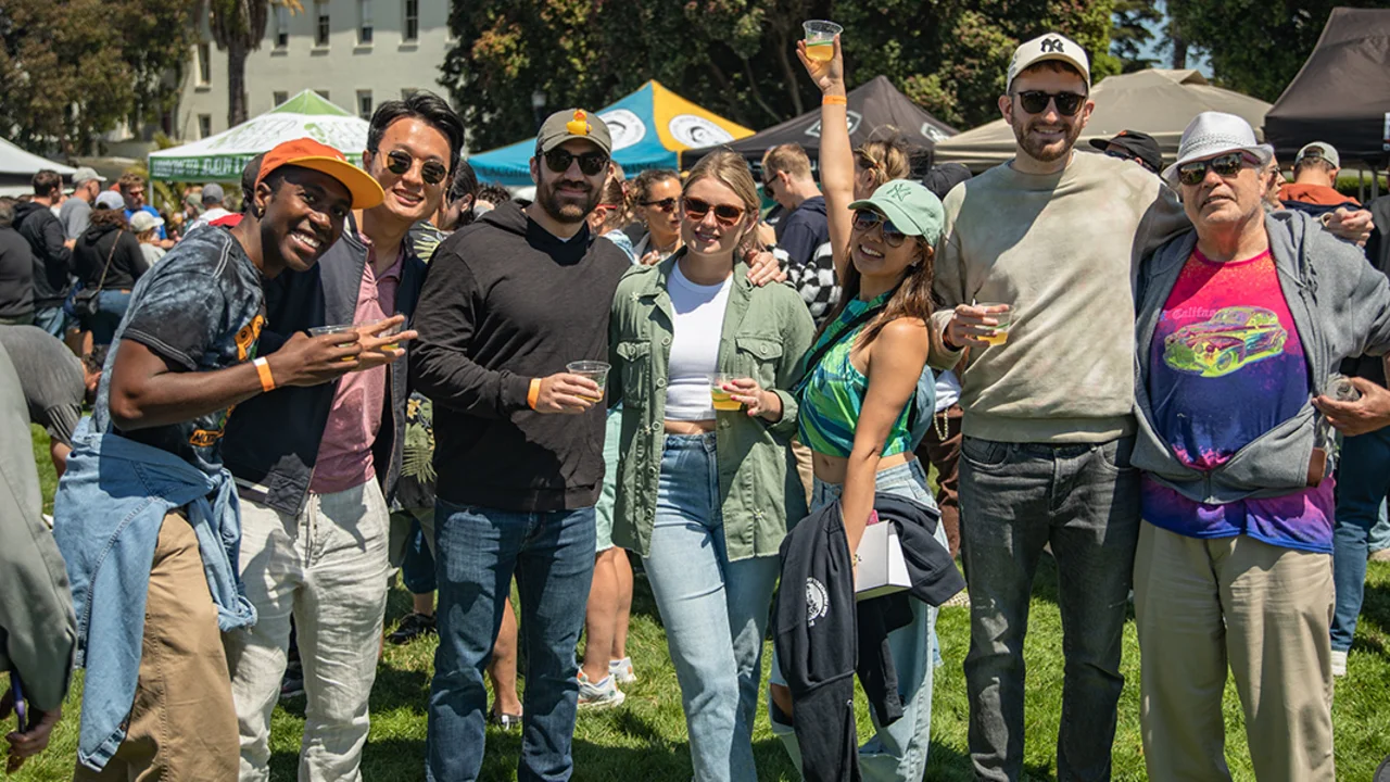 A group of friends line up for a photo at Parks4All: Brewfest, a beer festival and fundraiser, on Saturday, July 29th, 2023 in the Presidio of San Francisco.