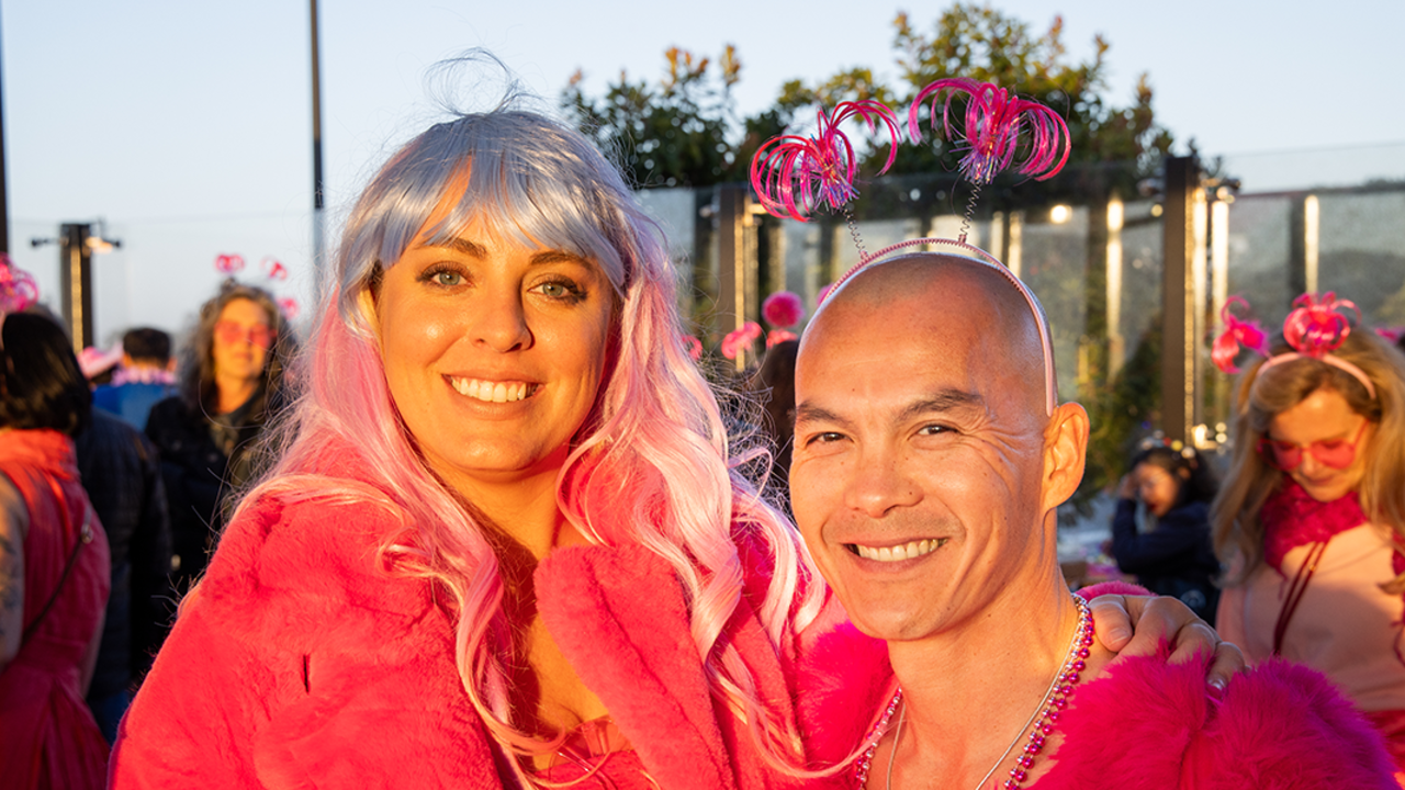 Attendees pose for a photo at Pink Full Moon Party 2025 at the Presidio Tunnel Tops.