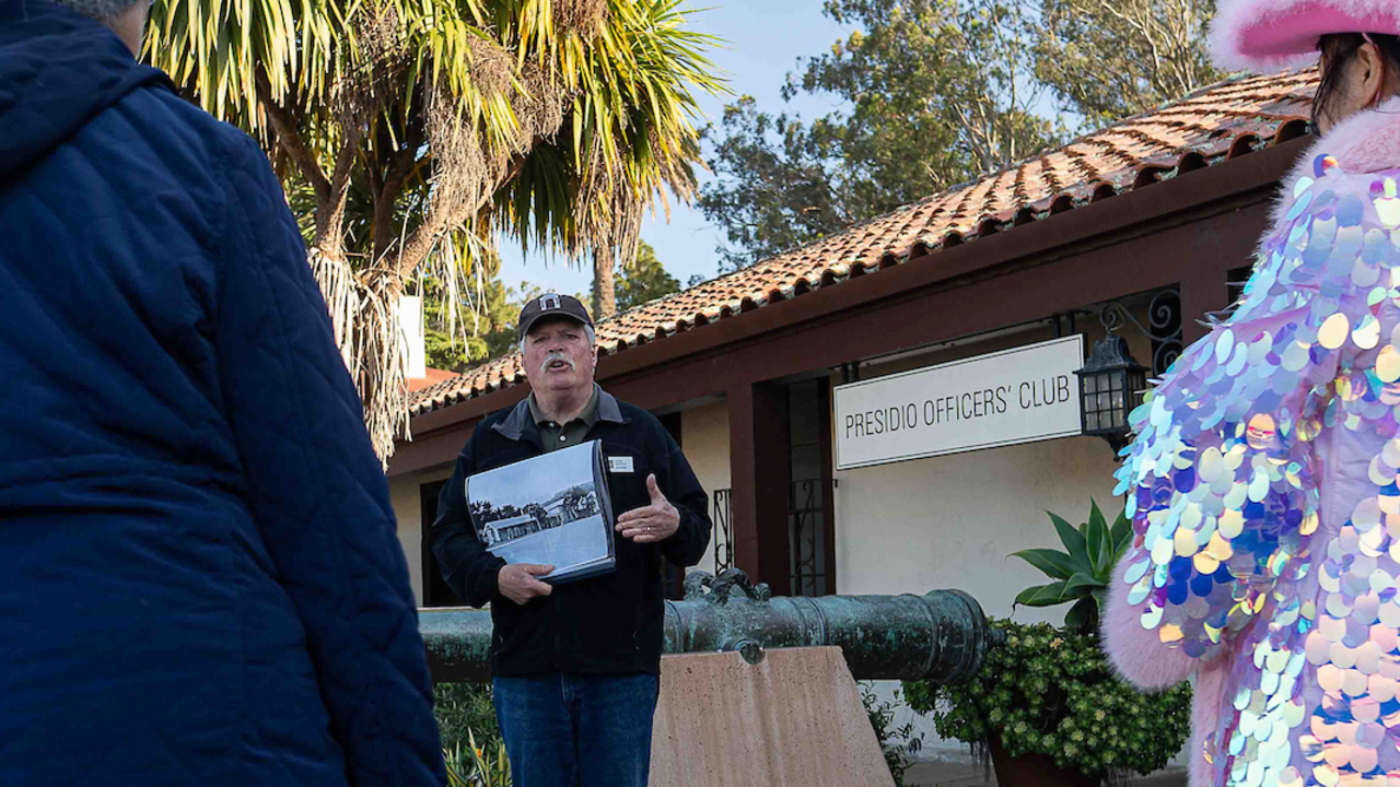 Local historian gives a tour of the Presidio's Main Post during Pink Full Moon Party 2025.