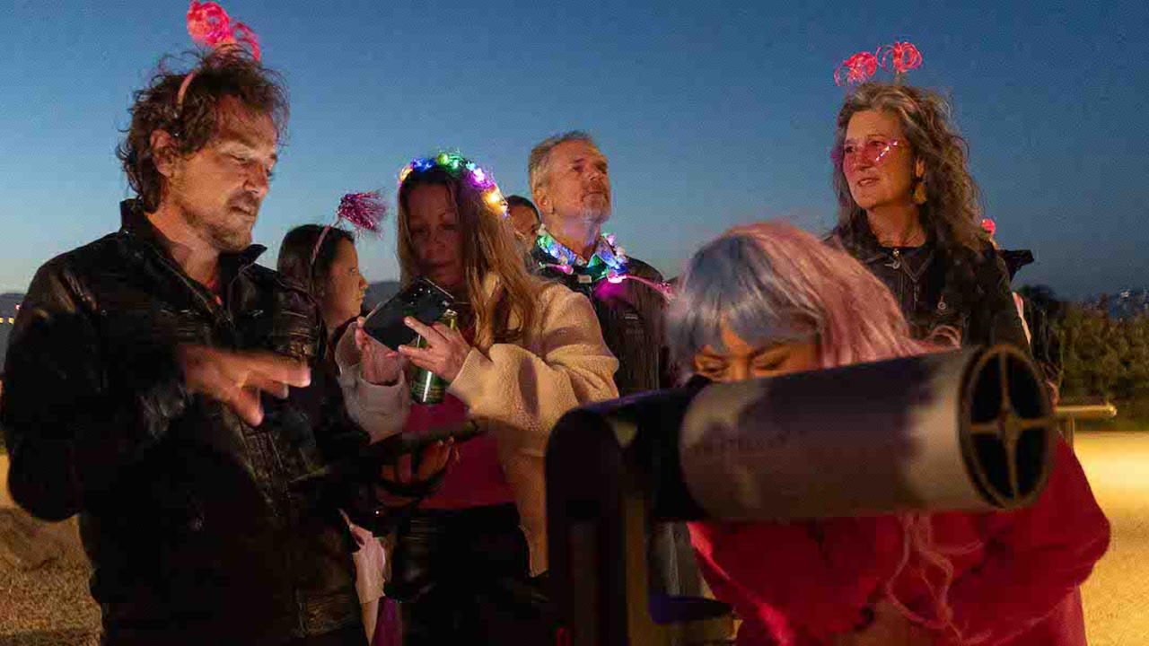 Attendees gaze at the moon with Unistellar Telescopes.