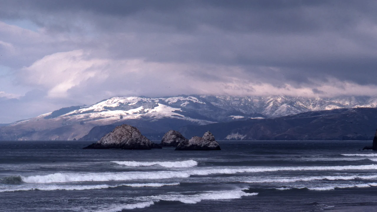 Snow on Marin Headlands from Ocean Beach