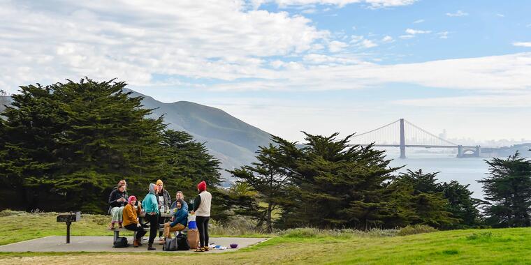 People picnic at Battery Wallace in Marin with Golden Gate Bridge views