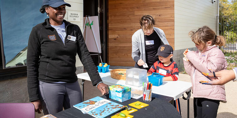 Yolanda Molette connects with participants at a workshop featuring butterfly migration.