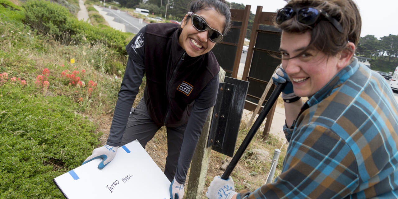 Parks Conservancy staff working on the installation of the StoryWalk at Lands End