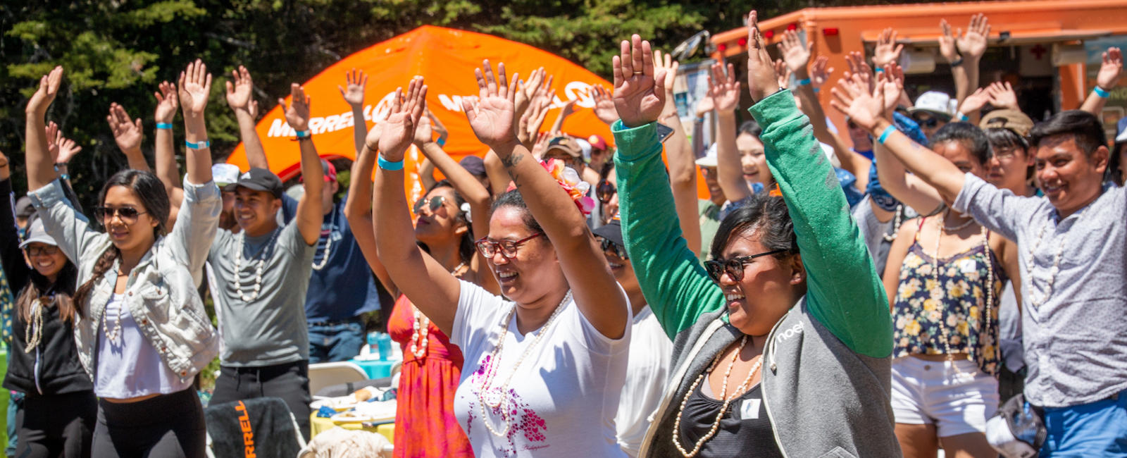 People raising hands in the air