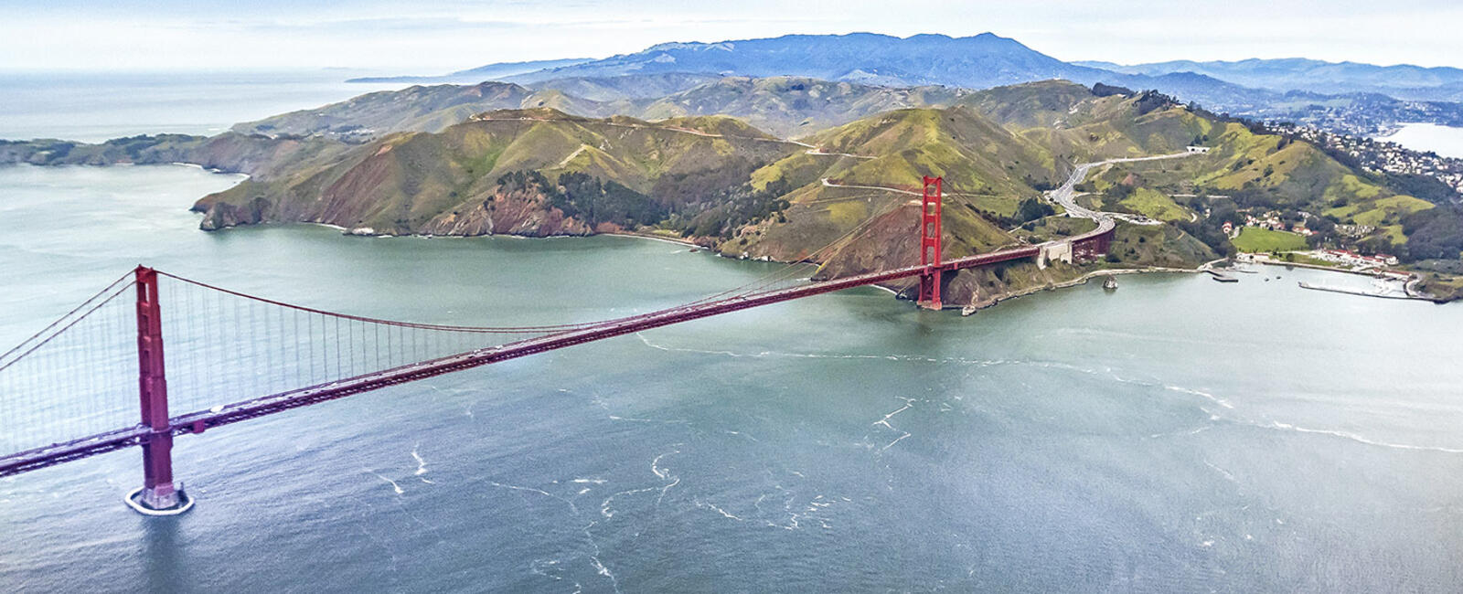 The Golden Gate Bridge, Marin Headlands and Mt. Tam seen in an aerial image.