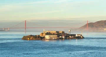 Aerial photograph of Alcatraz and the Golden Gate Bridge.