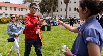 PRSF_20230729_BHS_020_2x1.jpg Parks Conservancy staff hand out souvenir beer tasting glasses at Parks4All: Brewfest, a beer festival and fundraiser, on Saturday, July 29th, 2023 in the Presidio of San Francisco.