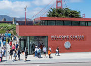 Crowds of people outside the Welcome Center on a beautiful, sunny day