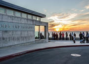 The outside of Lands End Lookout at sunset