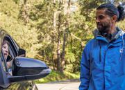 Driver shows Muir Woods parking reservation to attendent 