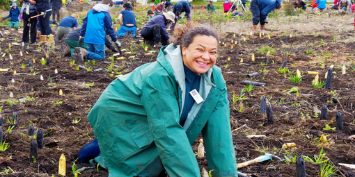 A participant gives a big smile during Presidio Planting Day