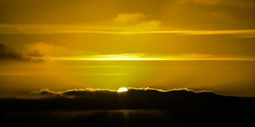 Sun breaking through storm clouds