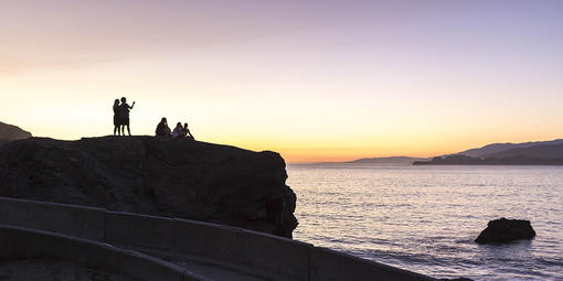 People enjoying the sunset from China Beach