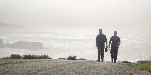 Visitors hike up the Coastal Trail from Rodeo Beach