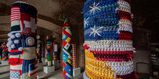 Pole surrounded by a knitted American flag at Fort Point National Historic Site