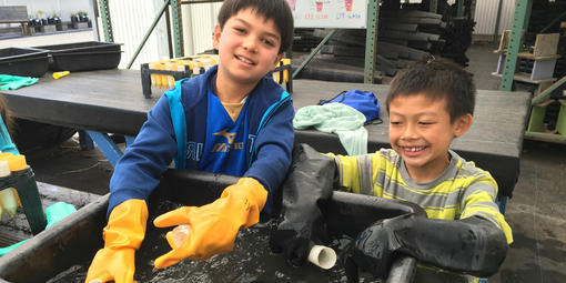 Young people help wash pots