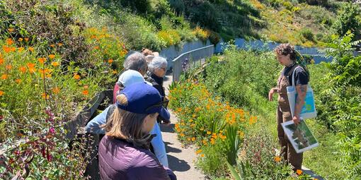 Natalie Korengold leading Parks Conservancy members through a tour of the gardens