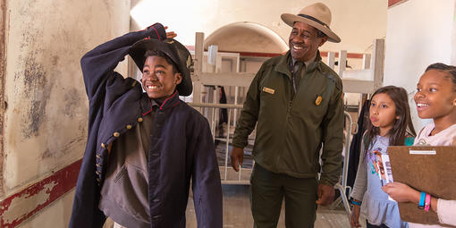 Ranger Rik Penn leads a program with youth at Fort Point in March 2018.