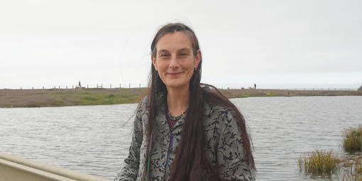 Portrait of Data manager Lizzy Edson smiling on the bridge by Rodeo Lagoon.