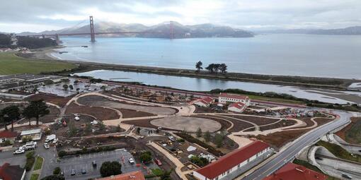 In progress shot of the Presidio Tunnel Tops with the Golden Gate Bridge visible in the background.