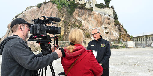John Cantwell talks to reporters on Alcatraz Island.