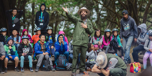 A national park ranger engages the youth