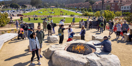 A crowd gathers around the Campfire Circle at the newly opened Presidio Tunnel Tops.