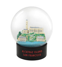 Model of Alcatraz inside a fog globe. The globe's base says "Alcatraz Island, San Francisco"