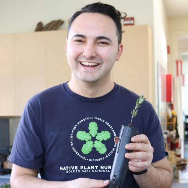 Brian Teng holding a potted manzanita