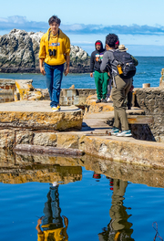 People walking on ruins of Sutro Baths