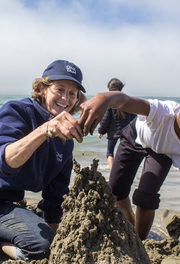Having fun with sand on the beach.