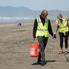 Volunteer removing litter at Ocean Beach